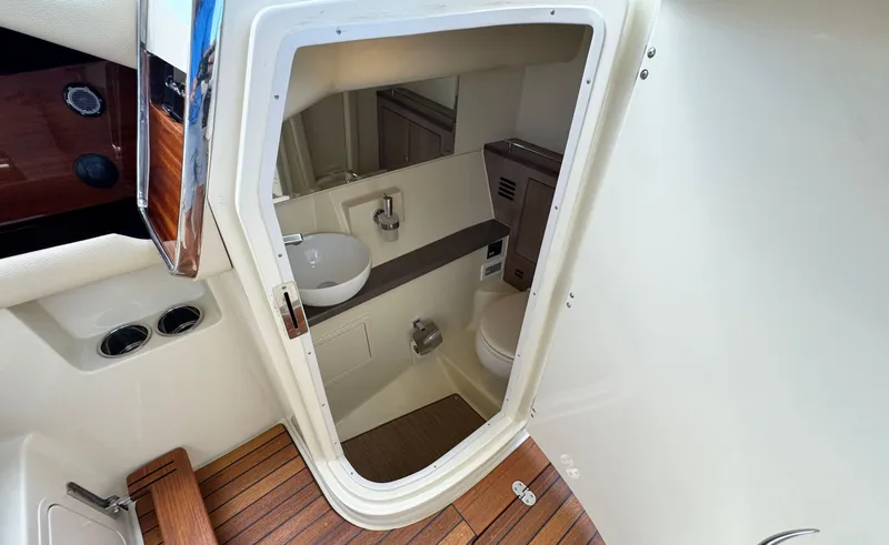 Slide: The Image of 2022 Chris-Craft Launch 35 GT I/O Heritage Edition boat interior bathroom with sink and toilet. - 29