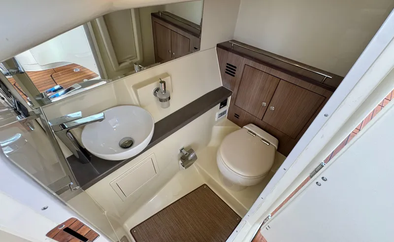 Slide: The Image of 2022 Chris-Craft Launch 35 GT I/O Heritage Edition boat bathroom with sink and toilet. - 30