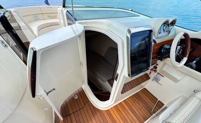 Slide: The Image of 2022 Chris-Craft Launch 35 GT I/O Heritage Edition interior with wood accents and modern controls. - 32