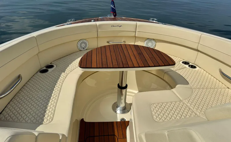 Slide: The Image of 2022 Chris-Craft Launch 35 GT I/O Heritage Edition boat interior with elegant seating and wooden table. - 39