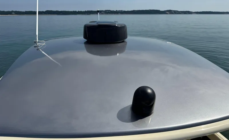 Slide: The Image of 2022 Chris-Craft Launch 35 GT I/O Heritage Edition boat on calm water. - 43