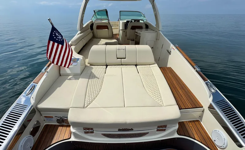 Slide: The Image of 2022 Chris-Craft Launch 35 GT I/O Heritage Edition boat with luxurious seating and American flag. - 9
