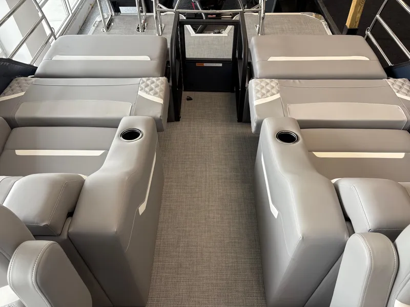 Slide: The Image of 2025 Crest 240 SLRC boat interior with gray seating and cup holders. - 4