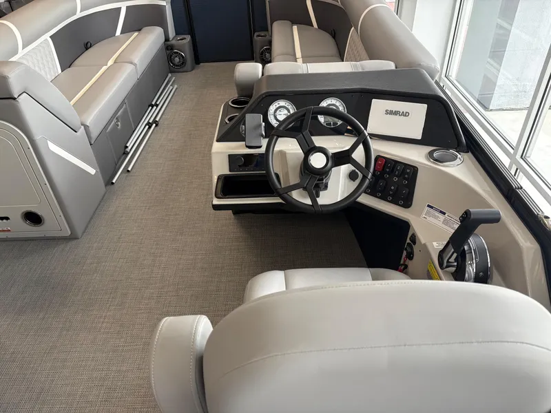 Slide: The Image of Interior of 2025 Crest 240 SLRC boat with modern steering and seating. - 6