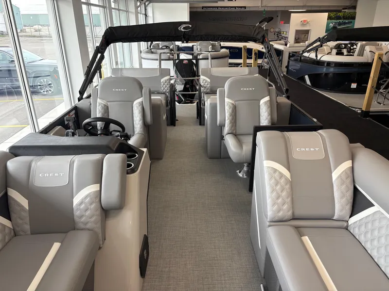 Slide: The Image of 2025 Crest 240 SLRC pontoon boat interior with luxurious gray seating and modern design. - 8