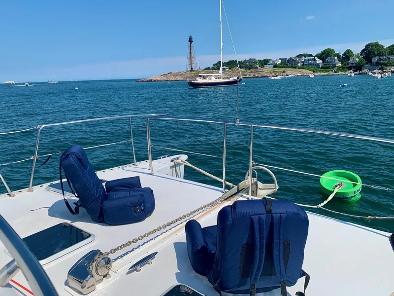 Slide: The Image of Storage compartment with fuel can, cables, and cleaning supplies on a 2003 PDQ-34 boat. - 12