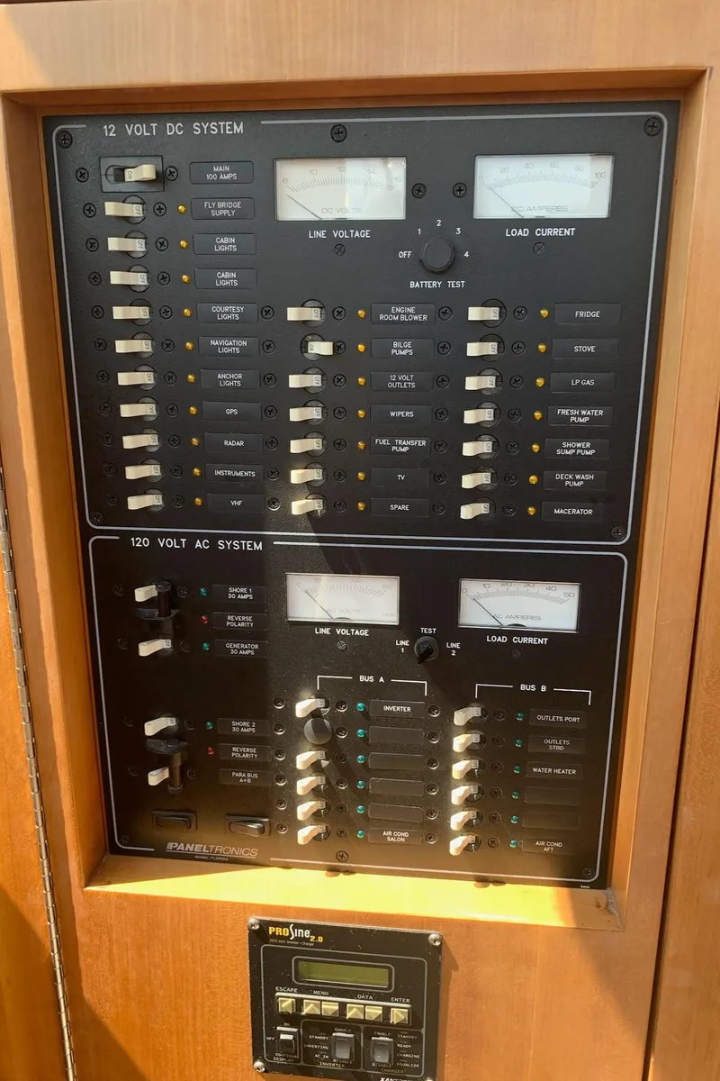 Slide: The Image of Interior of 2003 PDQ-34 boat with elegant rug and seating, American flag visible. - 28