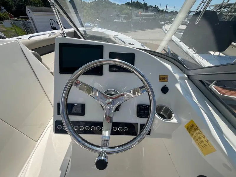 Slide: The Image of Steering console of 2026 Key West 239 DFS boat with modern controls and displays. - 10