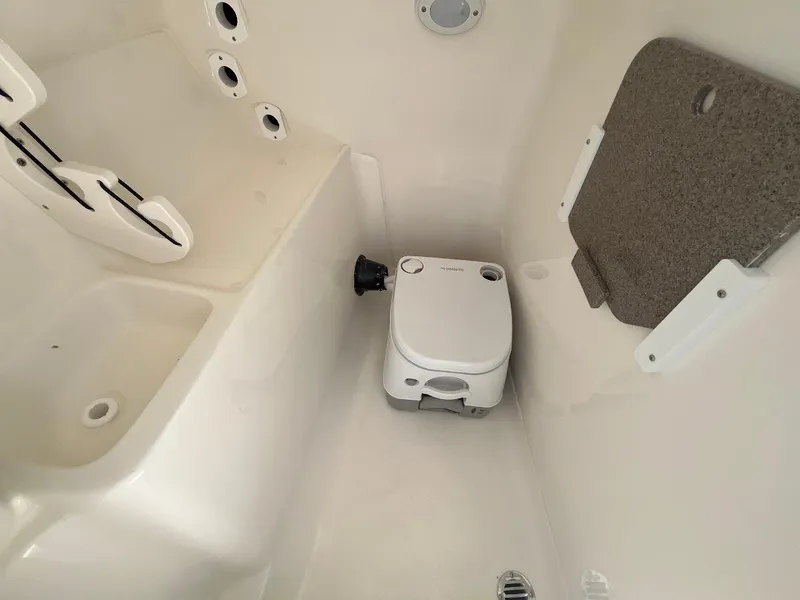 Slide: The Image of Compact marine toilet in 2026 Key West 239 DFS boat interior. - 11