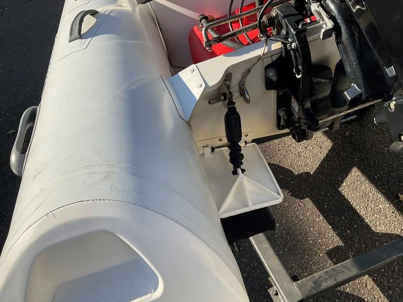 Slide: The Image of 2016 Brig F330HT inflatable boat with motor and fuel tank on a trailer. - 10