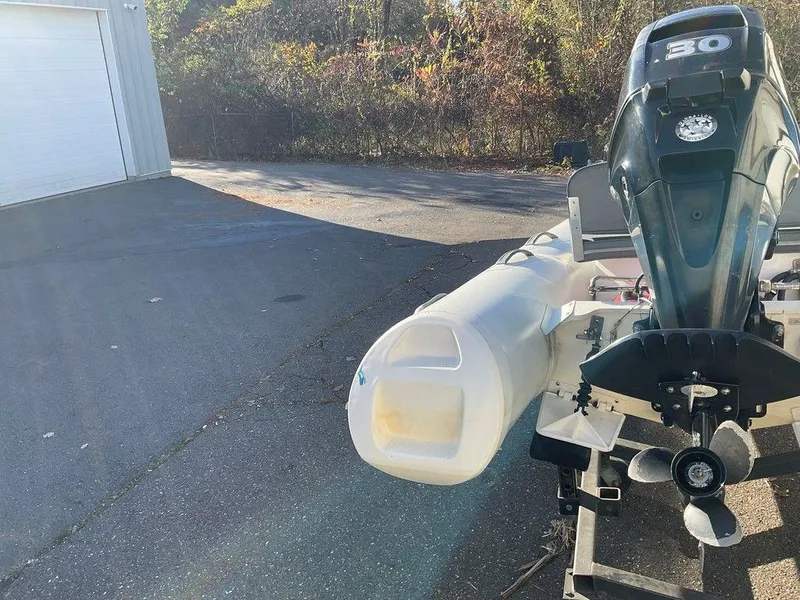 Slide: The Image of 2016 Brig F330HT inflatable boat with 30 HP outboard motor on a trailer. - 12