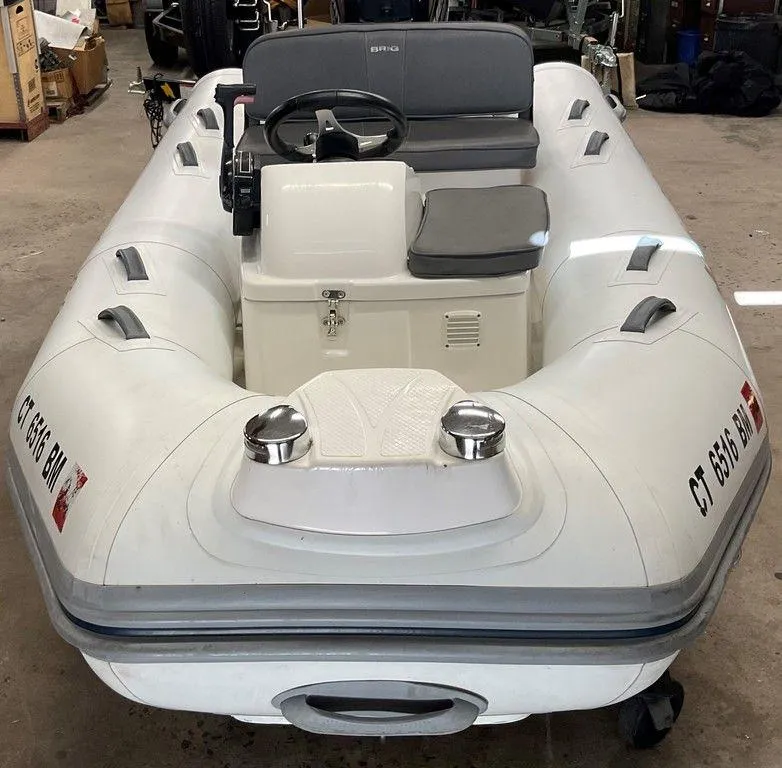 Slide: The Image of 2016 Brig F330HT inflatable boat in a garage setting. - 14