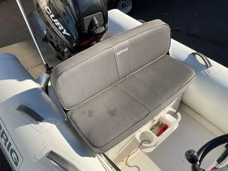 Slide: The Image of 2016 Brig F330HT inflatable boat with Mercury engine and gray seating. - 7