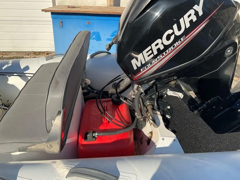 Slide: The Image of 2016 Brig F330HT inflatable boat with Mercury FourStroke outboard motor and red fuel tank. - 8