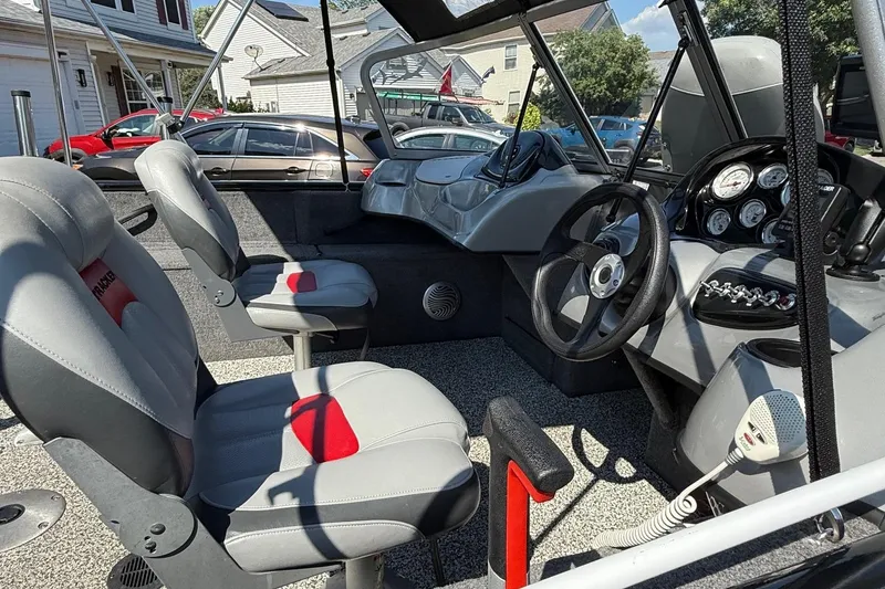 Slide: The Image of 2015 Tracker Pro Guide V-175 WT boat interior with steering wheel and seats. - 12