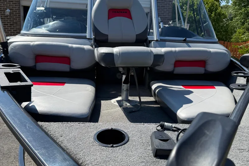 Slide: The Image of 2015 Tracker Pro Guide V-175 WT boat interior with gray and red seating. - 14
