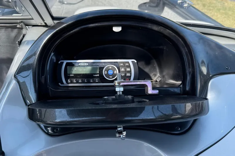 Slide: The Image of 2015 Tracker Pro Guide V-175 WT boat dashboard with stereo system. - 15