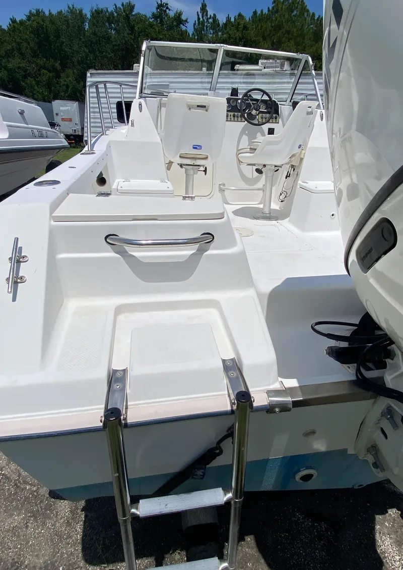 Slide: The Image of 1999 Key West 2020WA Bluewater boat with ladder and cockpit view. - 4