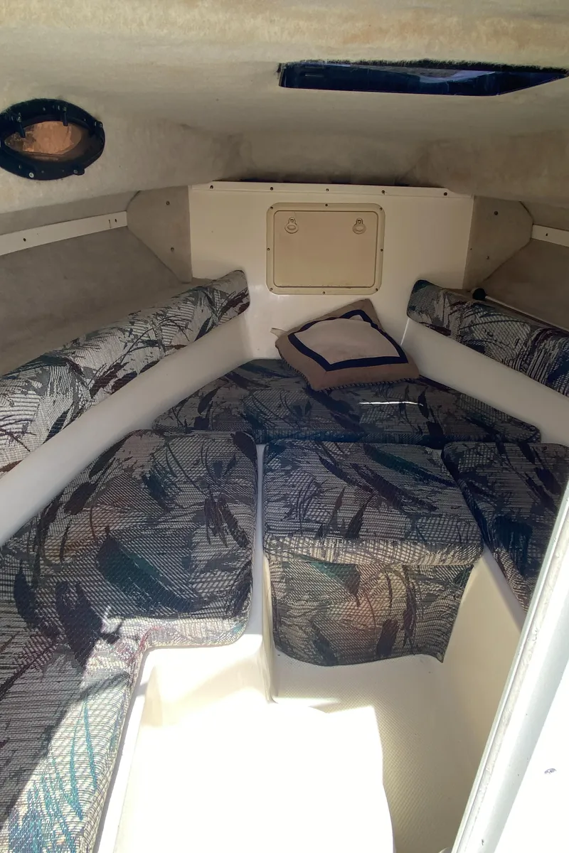 Slide: The Image of Interior cabin of 1999 Key West 2020WA Bluewater boat with patterned seating. - 9