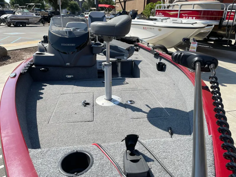 Slide: The Image of 2022 Tracker Super Guide V-16 SC boat interior with seating and control panel. - 3