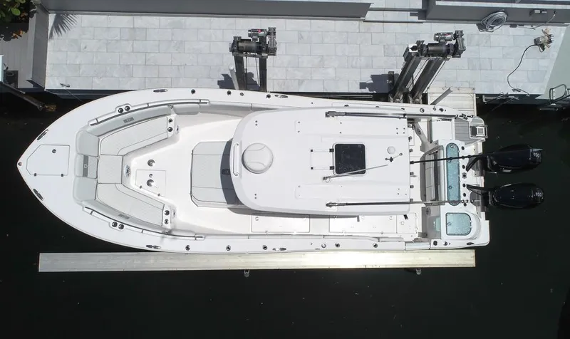 Slide: The Image of 2024 Sea Fox 328 Commander boat, aerial view, docked with dual engines. - 12