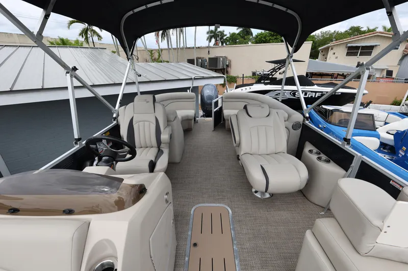 Slide: The Image of 2019 Bennington SX 22 SSXP pontoon boat interior with plush seating and canopy. - 12