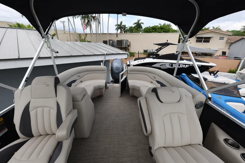 Slide: The Image of 2019 Bennington SX 22 SSXP pontoon boat interior with plush seating and canopy. - 13
