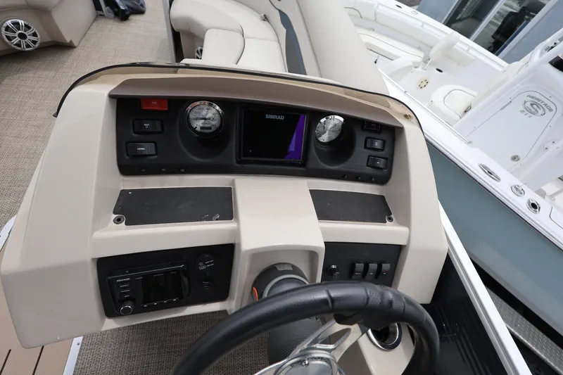 Slide: The Image of Dashboard of a 2019 Bennington SX 22 SSXP boat with steering wheel and controls. - 21