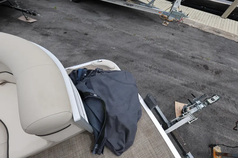 Slide: The Image of 2019 Bennington SX 22 SSXP pontoon boat with beige seating and trailer hitch. - 24