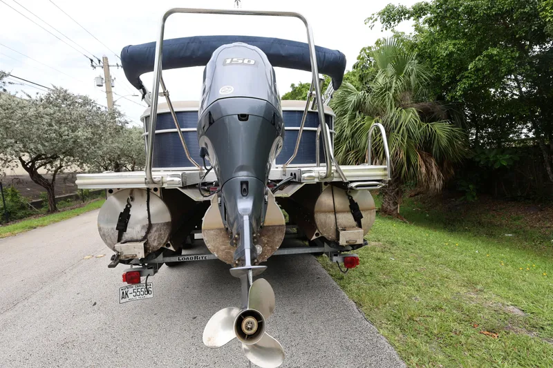 Slide: The Image of 2019 Bennington SX 22 SSXP pontoon boat with 150 HP engine on trailer. - 3