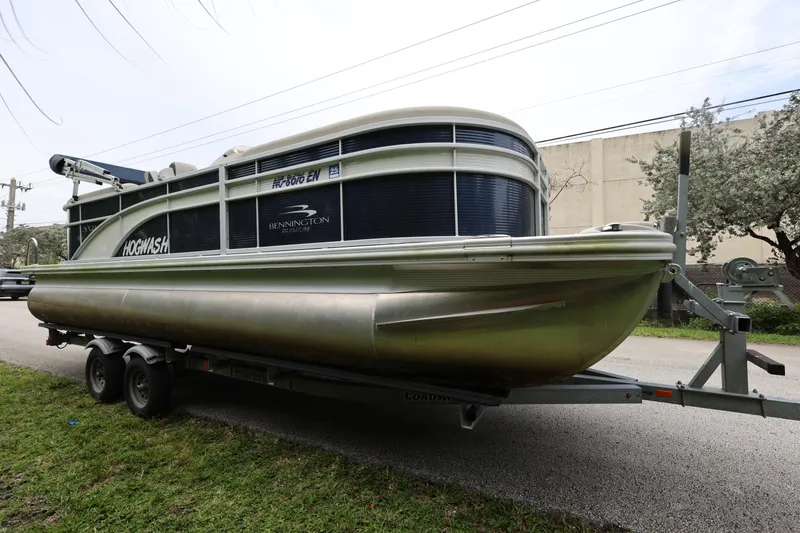 Slide: The Image of 2019 Bennington SX 22 SSXP pontoon boat on trailer, parked outdoors. - 5