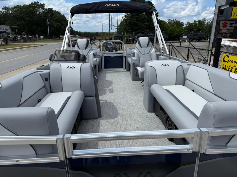 Slide: The Image of 2025 Avalon VENTURE QUAD LOUNGER pontoon boat with spacious seating and modern design. - 11