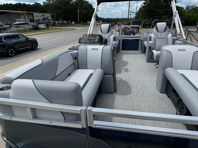 Slide: The Image of 2025 Avalon VENTURE QUAD LOUNGER pontoon boat with luxurious gray seating and modern design. - 13