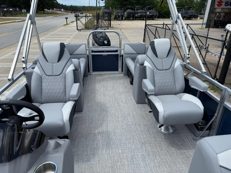 Slide: The Image of 2025 Avalon VENTURE QUAD LOUNGER pontoon boat with luxurious gray seating and modern design. - 15