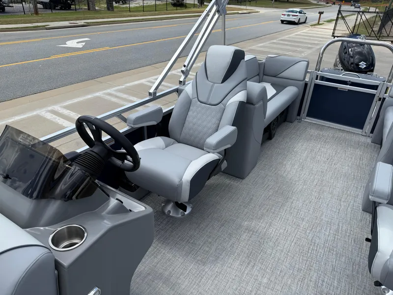 Slide: The Image of 2025 Avalon VENTURE QUAD LOUNGER interior with modern seating and steering console. - 17