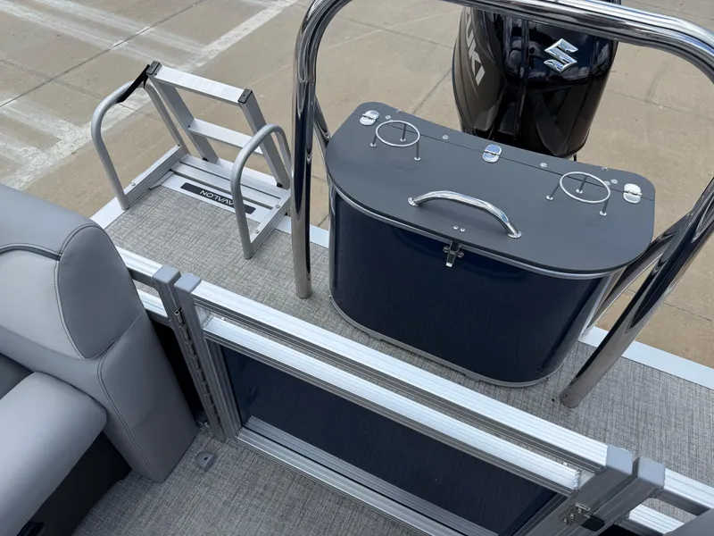 Slide: The Image of 2025 Avalon VENTURE QUAD LOUNGER boat interior with seating, ladder, and motor. - 23