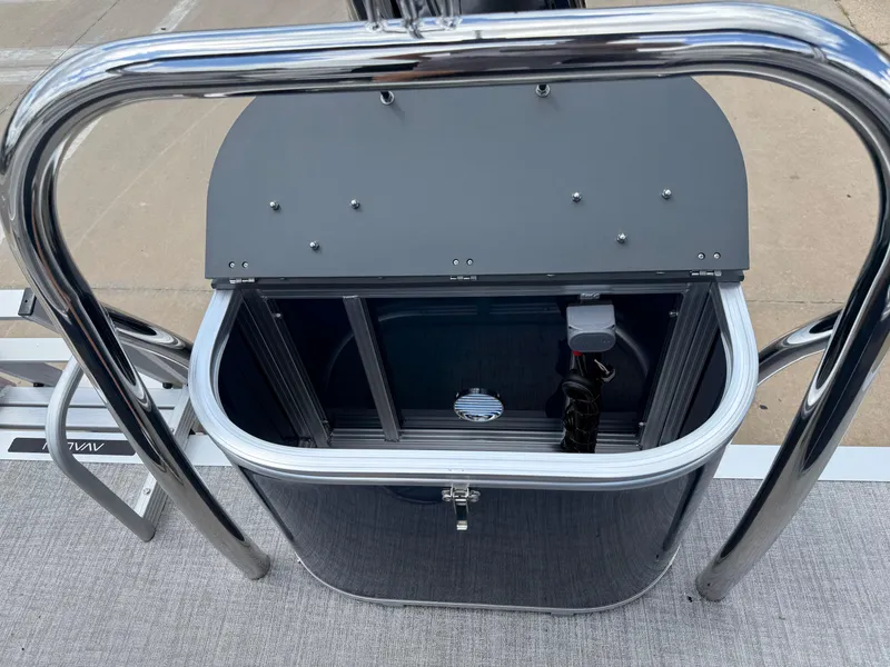 Slide: The Image of 2025 Avalon VENTURE QUAD LOUNGER storage compartment with sleek metal railing design. - 24