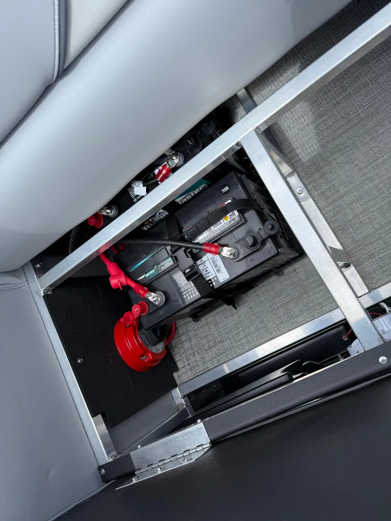 Slide: The Image of Battery compartment of 2025 Avalon VENTURE QUAD LOUNGER, featuring secure wiring and modern design. - 31