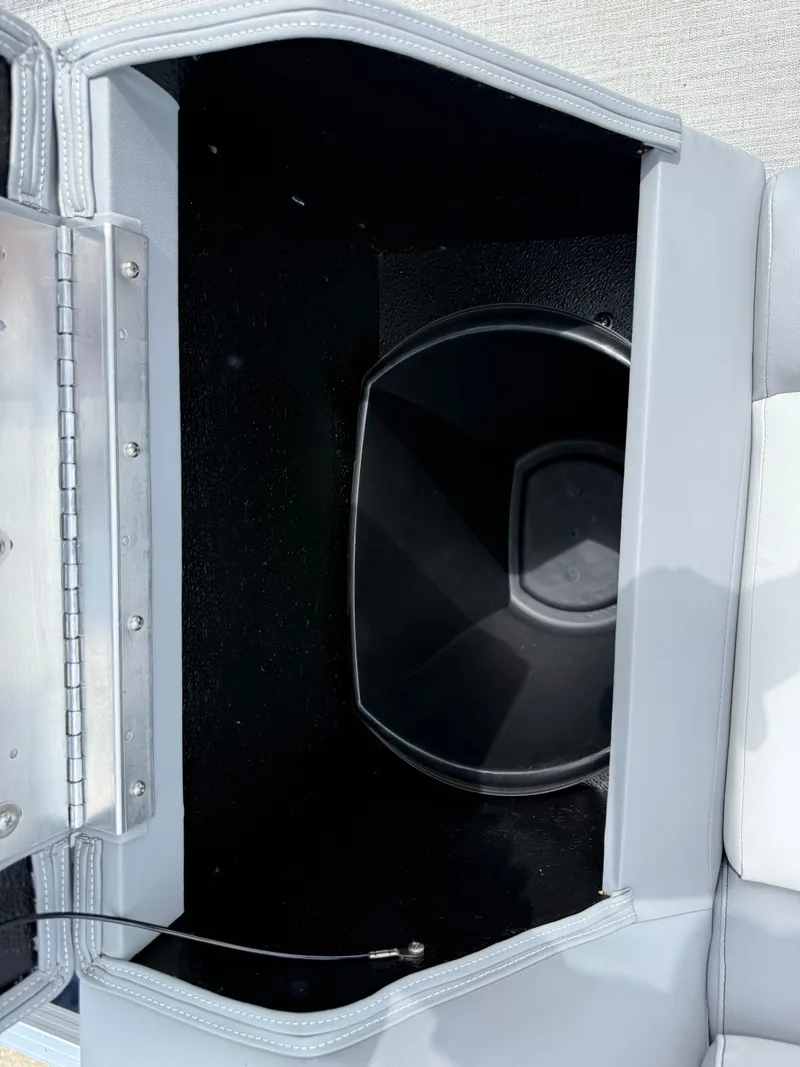 Slide: The Image of Open storage compartment in 2025 Avalon VENTURE QUAD LOUNGER boat, featuring sleek design and wiring. - 33