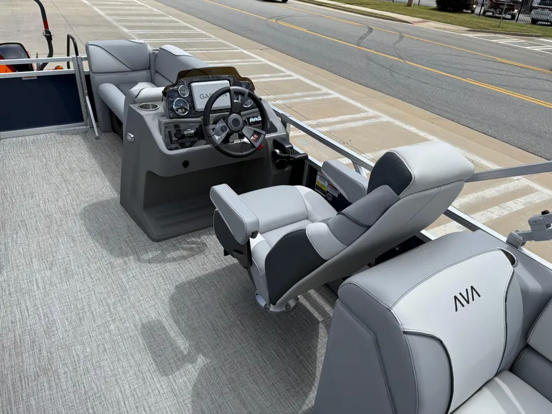 Slide: The Image of 2025 Avalon VENTURE QUAD LOUNGER interior with modern steering and comfortable seating. - 34