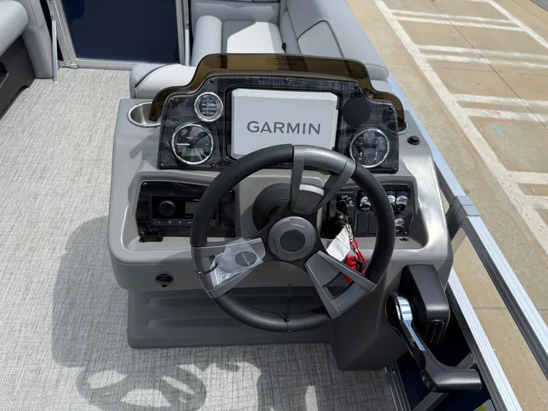 Slide: The Image of Steering console of 2025 Avalon Venture Quad Lounger with Garmin navigation system. - 38