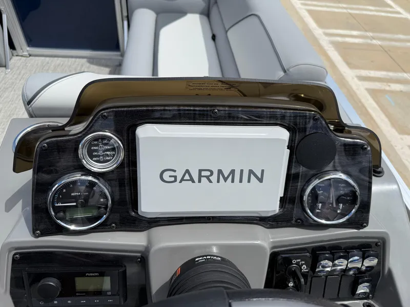 Slide: The Image of Dashboard of 2025 Avalon Venture Quad Lounger with Garmin display and gauges. - 39