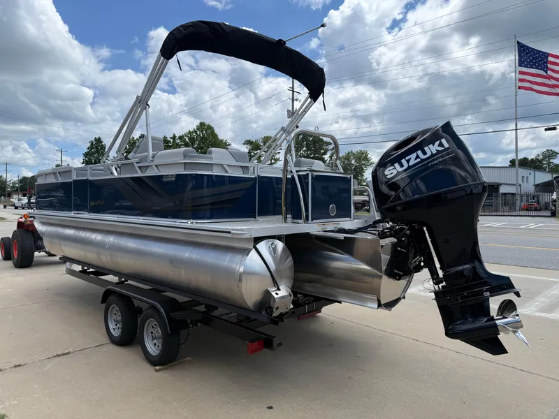 Slide: The Image of 2025 Avalon VENTURE QUAD LOUNGER pontoon boat with Suzuki outboard motor on trailer. - 4