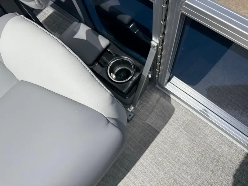 Slide: The Image of Avalon VENTURE QUAD LOUNGER 2025 interior with gray seating and built-in cup holder. - 47