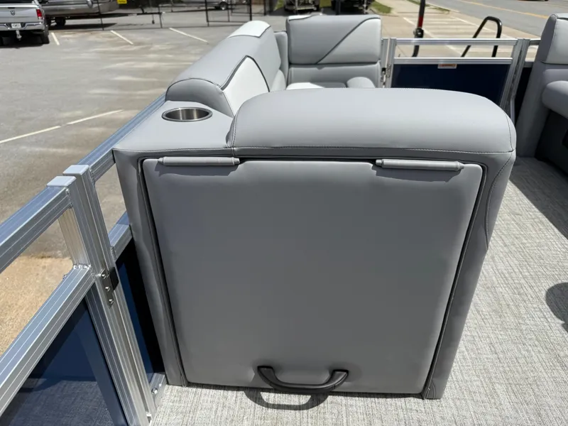 Slide: The Image of 2025 Avalon VENTURE QUAD LOUNGER with gray seating and cup holder on a pontoon boat. - 48