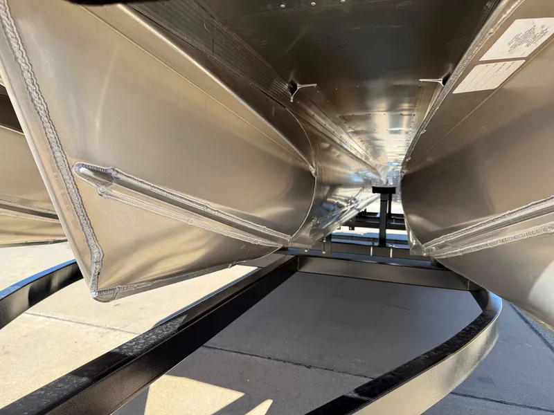 Slide: The Image of Underneath view of 2025 Avalon VENTURE QUAD LOUNGER pontoon boat on a trailer. - 50