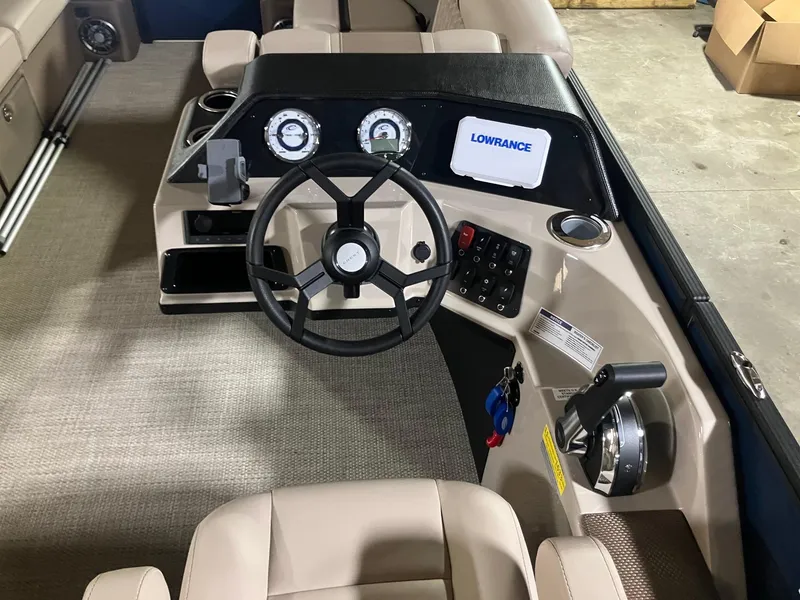 Slide: The Image of 2025 Crest 220 SLSC boat dashboard with steering wheel, gauges, and Lowrance display. - 5