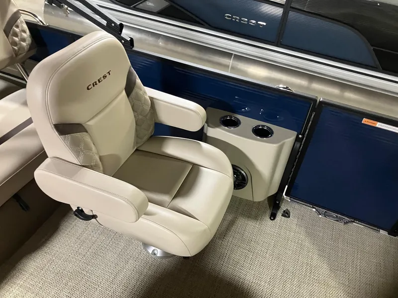Slide: The Image of Luxurious seating in 2025 Crest 220 SLSC boat with cup holders and elegant design. - 6