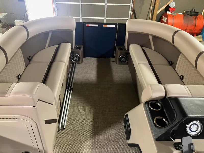 Slide: The Image of Interior of 2025 Crest 220 SLSC boat with beige seating and modern design. - 7