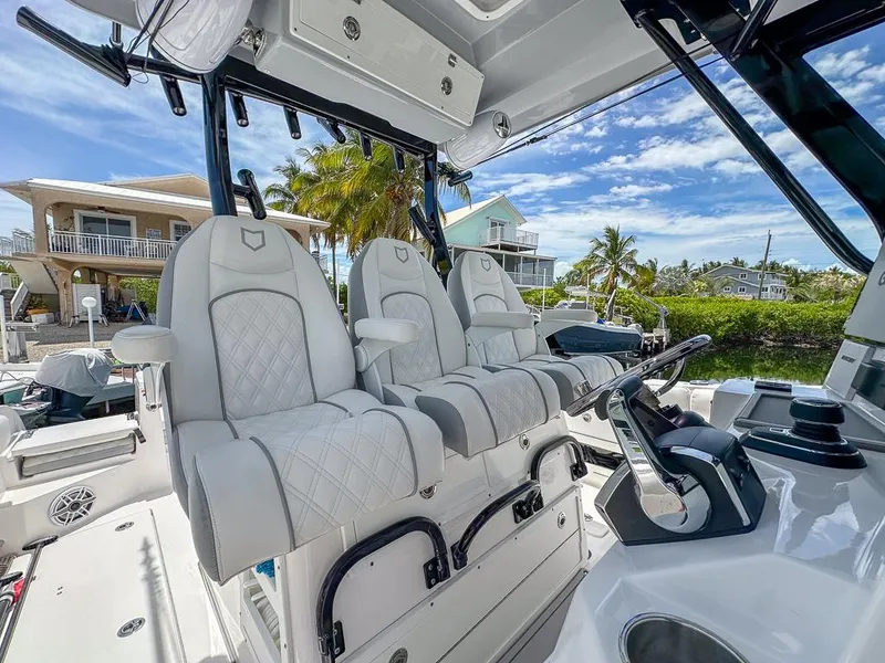 Slide: The Image of 2024 Sea Fox 328 Commander boat interior with luxurious seating and modern controls. - 21